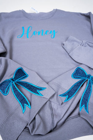 Rock You Design It Embroidered Side Bows Unisex NuBlend Crew Sweatshirt *Customize Your Text - Wholesale Accessory Market