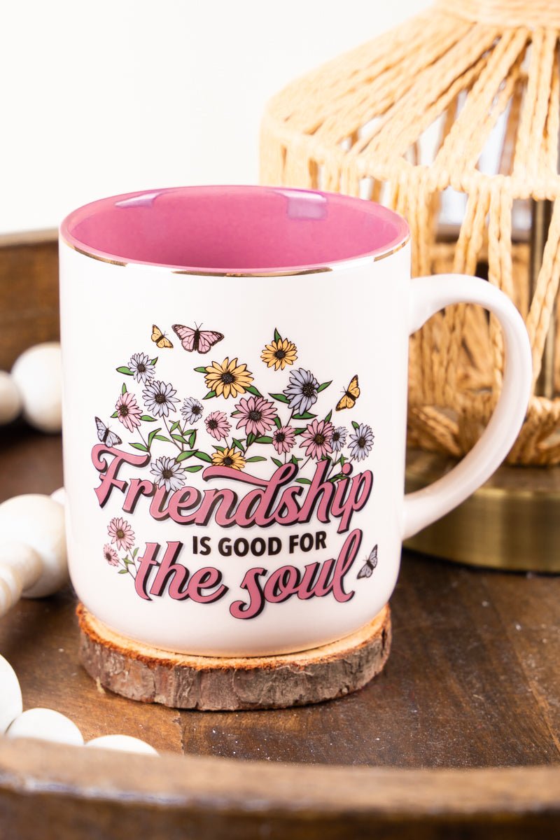 https://www.wholesaleaccessorymarket.com/cdn/shop/products/mug929friendship-is-good-for-the-soul-white-daisies-mug-164809_1200x.jpg?v=1684867354