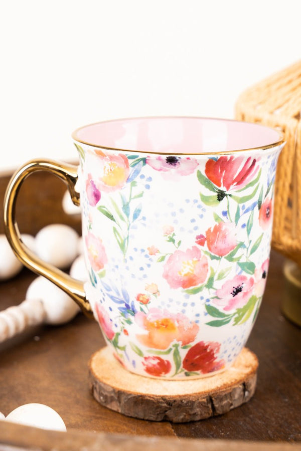 https://www.wholesaleaccessorymarket.com/cdn/shop/products/mug962strength-dignity-pastel-floral-mug-369369_600x.jpg?v=1684870966